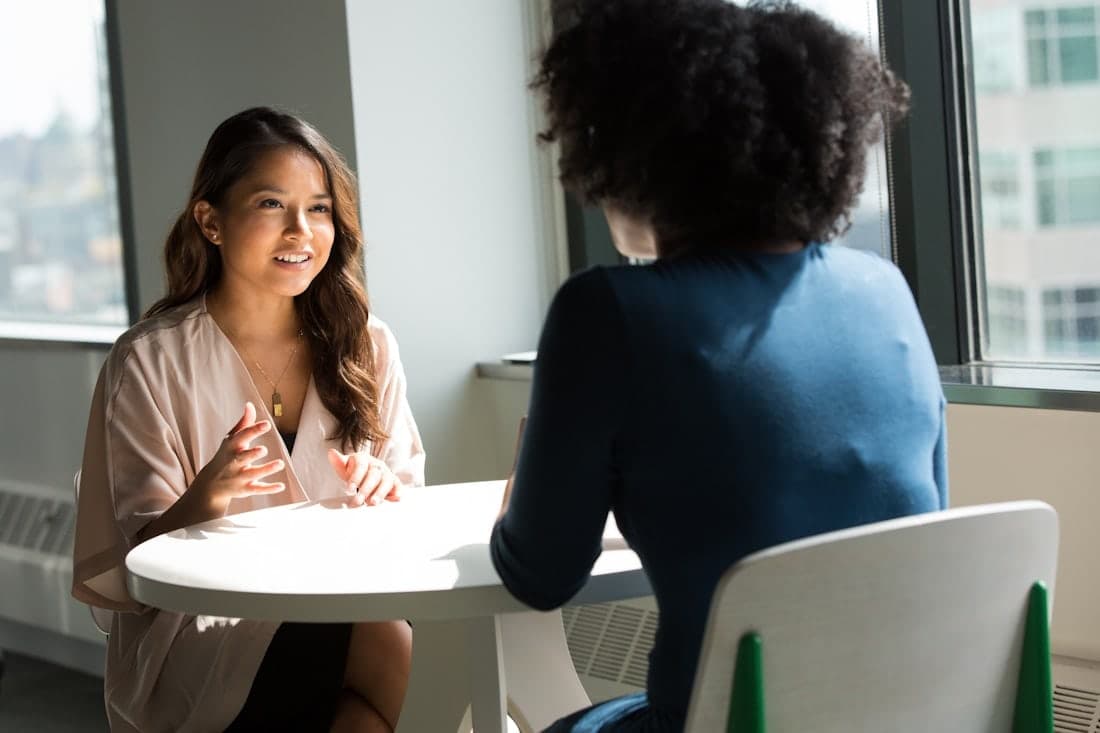 Business professionals in a meeting — become a Vigilant Eyes channel partner
